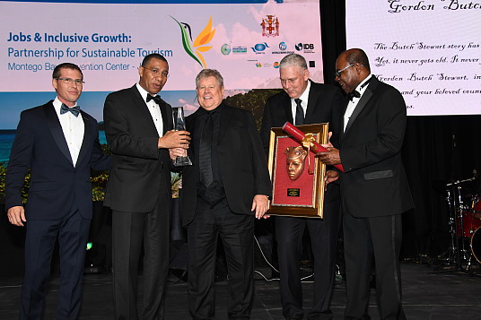 Chairman and founder of Sandals Resorts International, Gordon “Butch” Stewart, was honoured recently at The United Nations World Tourism Organization (UNWTO), Government of Jamaica, World Bank Group and Inter-American Development Bank’s Global Conference on Jobs and Inclusive Growth: Partnerships for Sustainable Tourism held in Montego Bay, November 27 – 29, 2017 Chairman and founder of Sandals Resorts International, Gordon “Butch” Stewart, was honoured recently at The United Nations World Tourism Organization (UNWTO), Government of Jamaica, World Bank Group and Inter-American Development Bank’s Global Conference on Jobs and Inclusive Growth: Partnerships for Sustainable Tourism held in Montego Bay, November 27 – 29, 2017